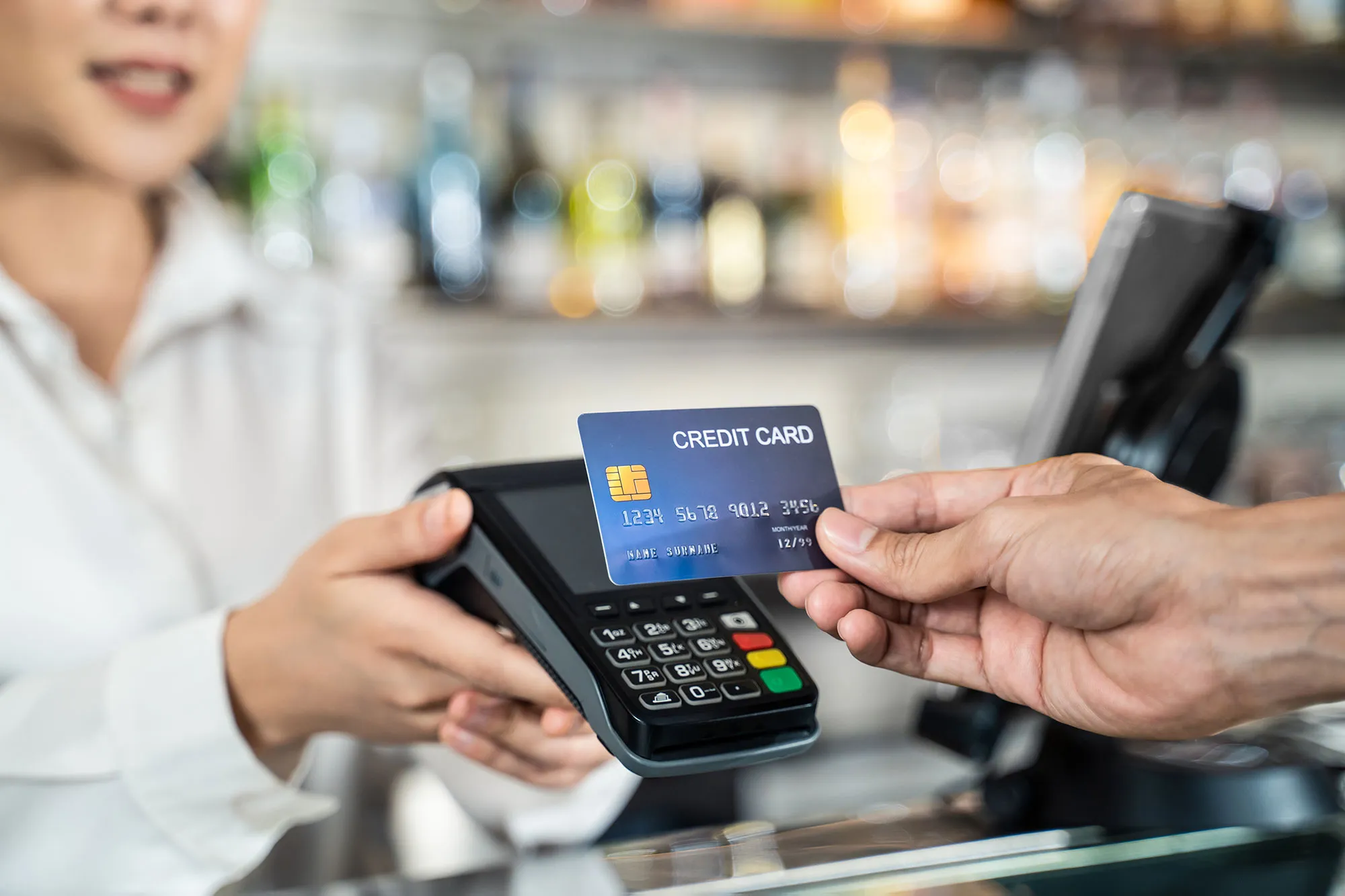 How the Right Point-of-sale System Can Transform Your Business 1 close up of customer hand using dummy credit card 2023 11 27 05 28 34 utc